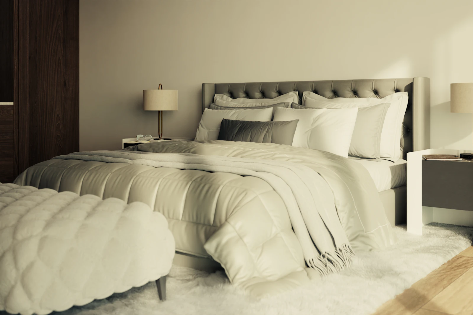 Made bed with tufted headboard, layered pillows, and plush bedding.