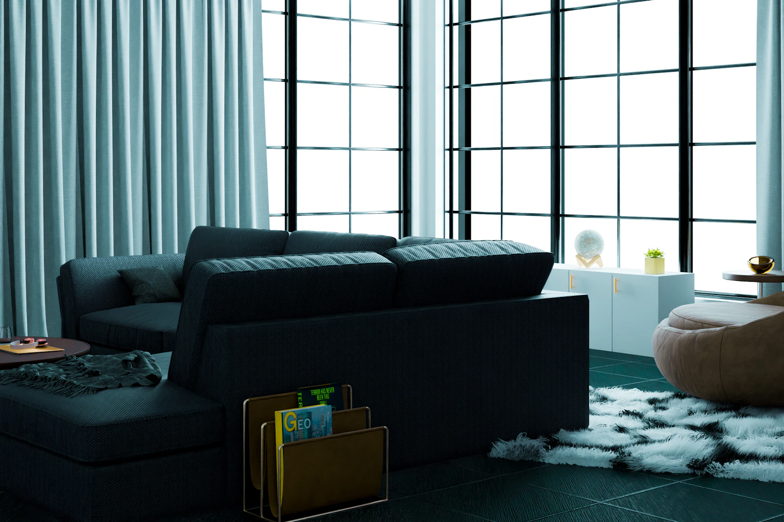 Bright living room with sofa, cushions, and large windows.